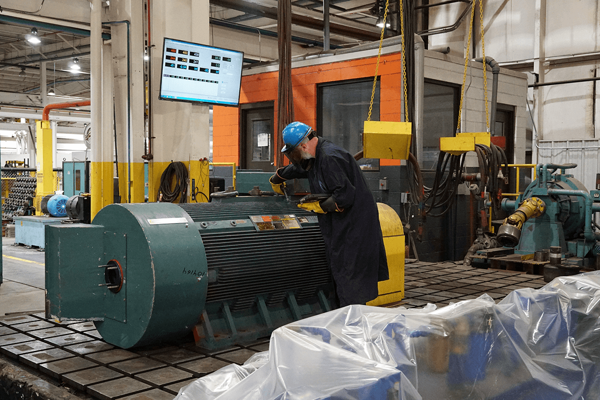 Smith Services expert testing an electric motor on their inhouse test stand for electric motor repair and generator repair.